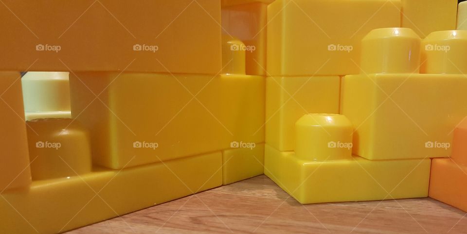 Close up of stacked plastic children's toy building blocks.