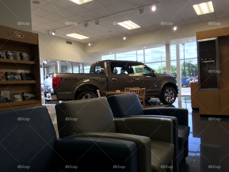 Sitting at the Ford dealership lobby waiting to have another vehicle serviced. Looking.
