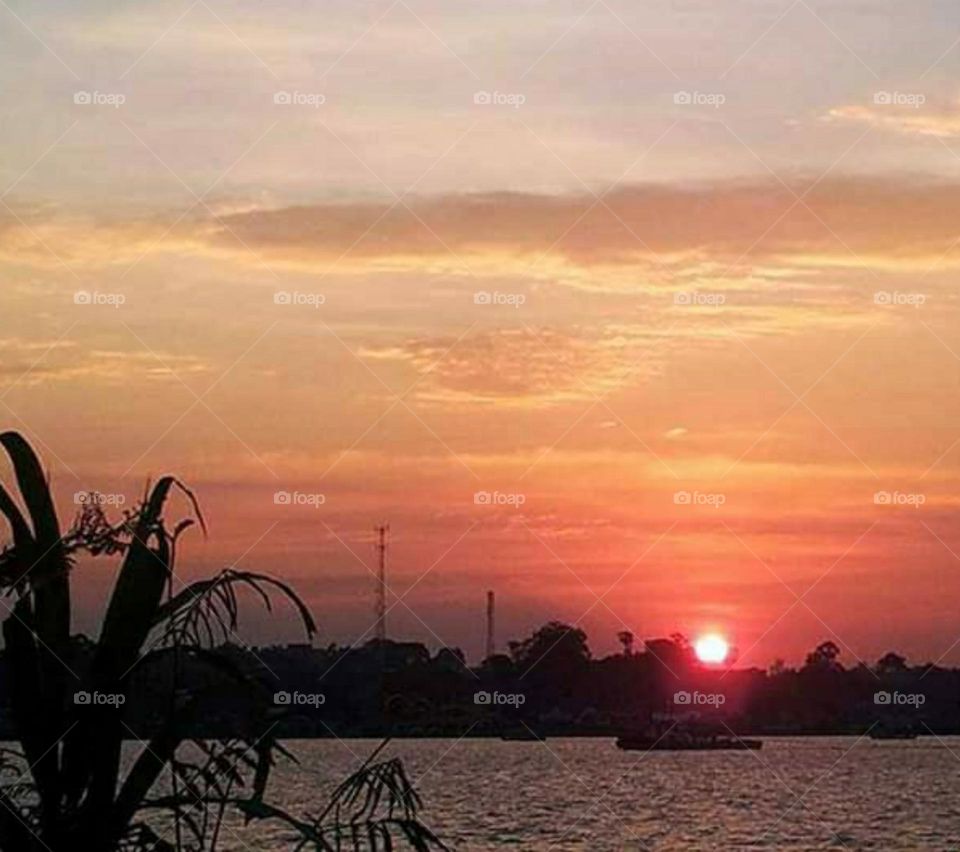 sunset at the end of the river