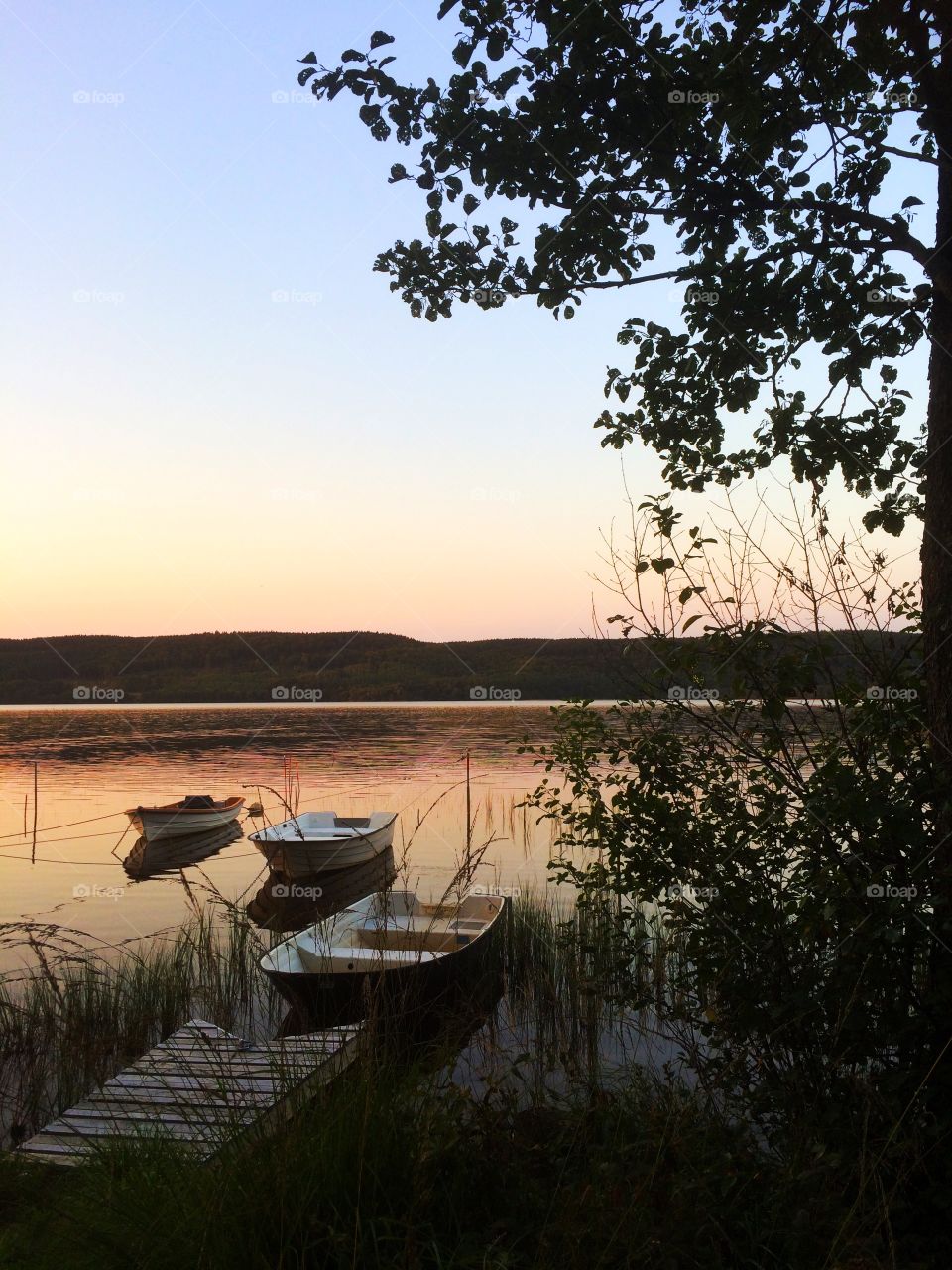 Scenic view of boats in lake