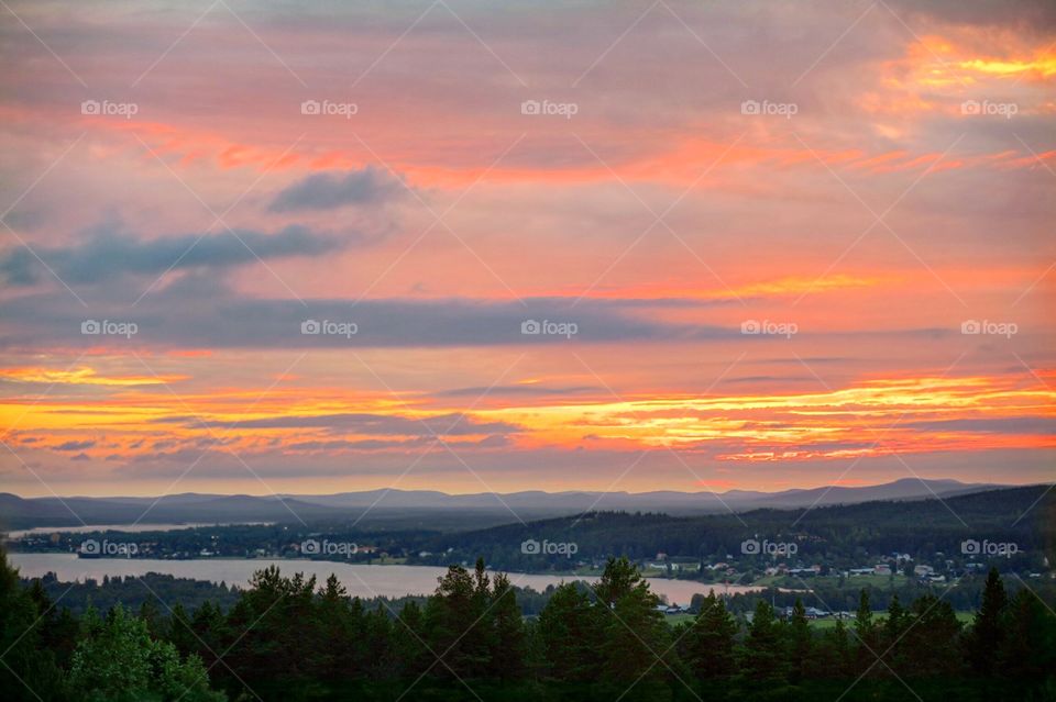 Sunset from mountain with water 