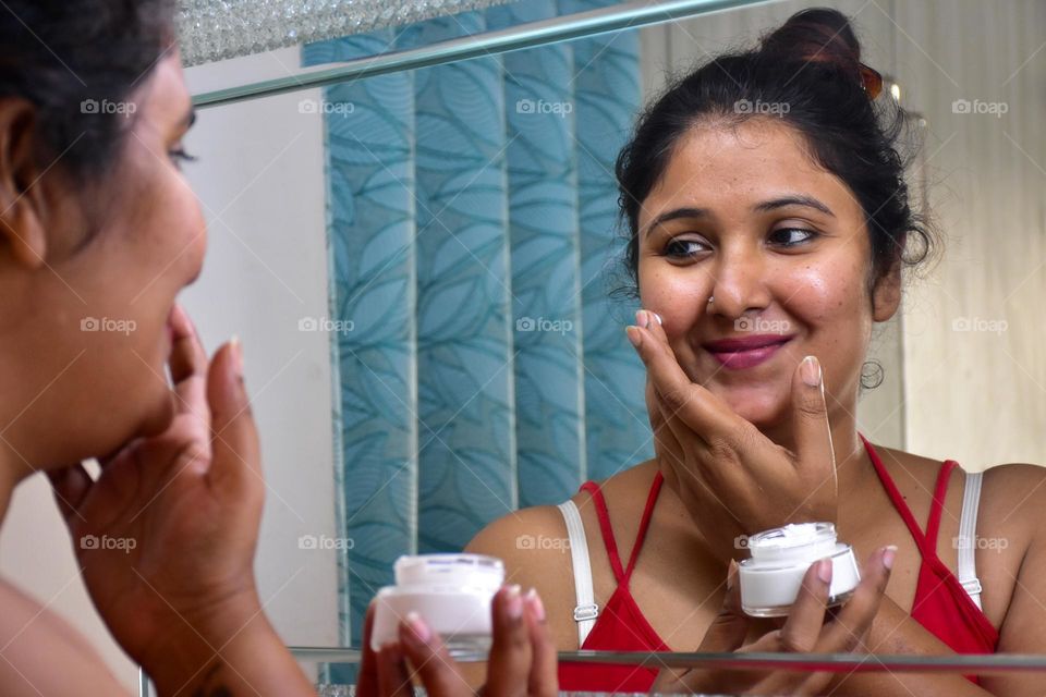 Woman applying cream