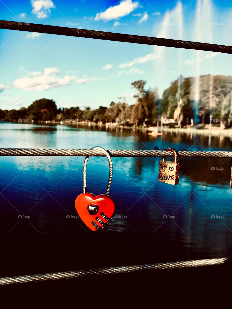 Love locks on the bridge over the lake. 