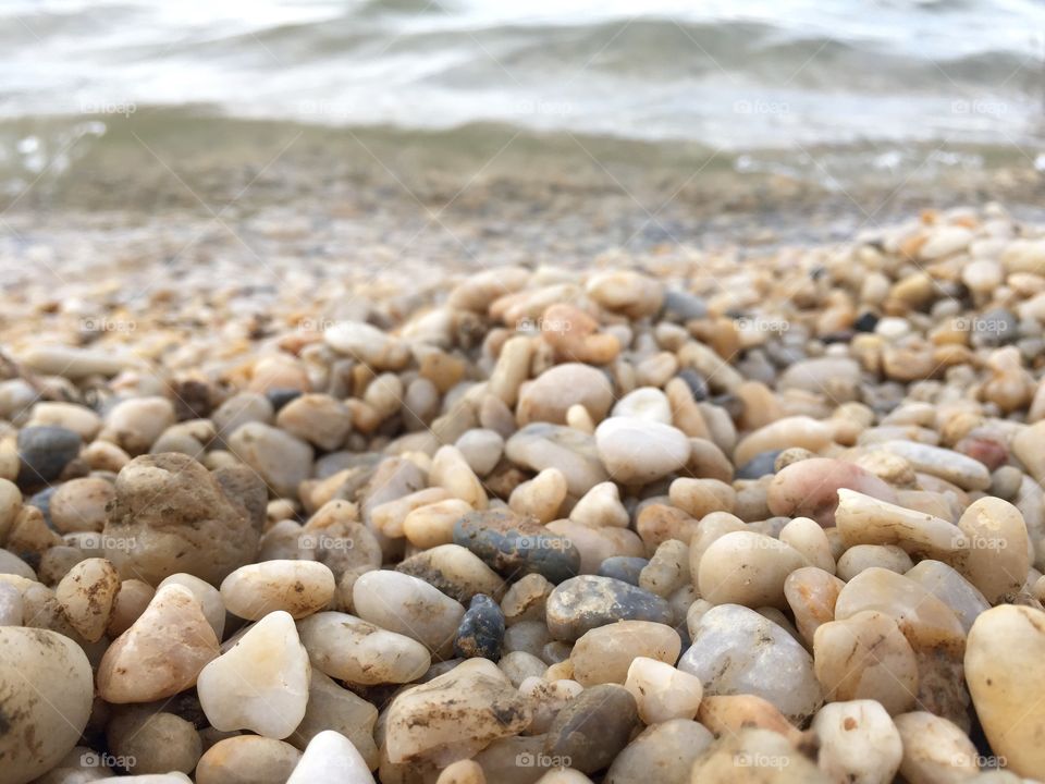 Scenic view of pebbles on beach