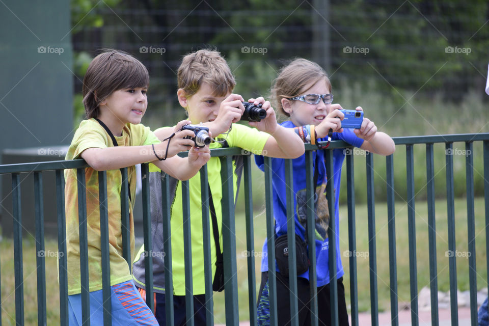 Children clicking photograph with camera