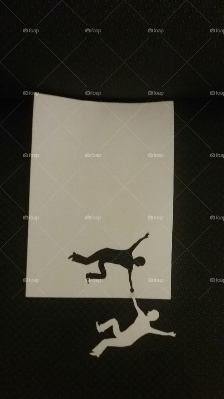 Paper Cutout falling man/rescuing man