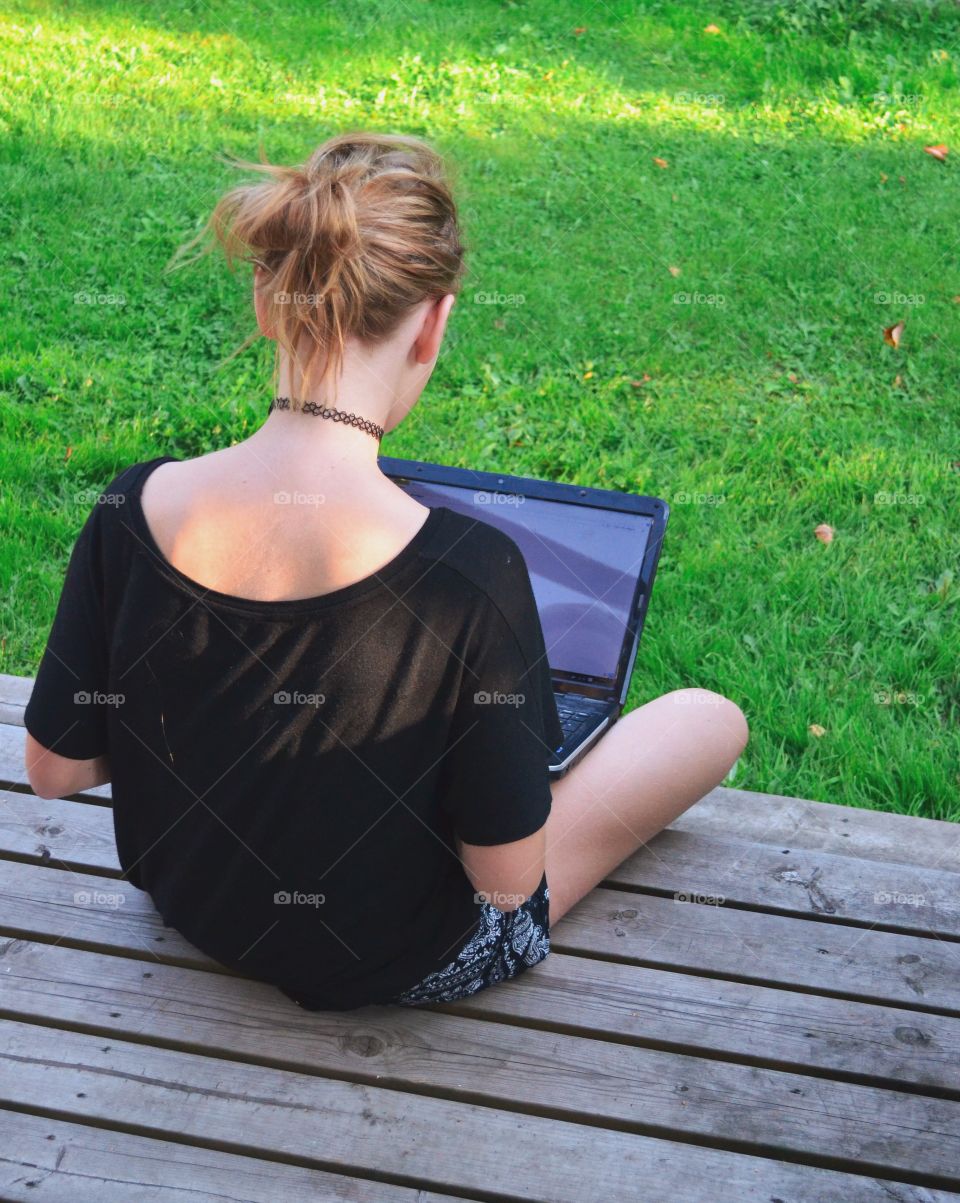 Girl sitting with an laptop 