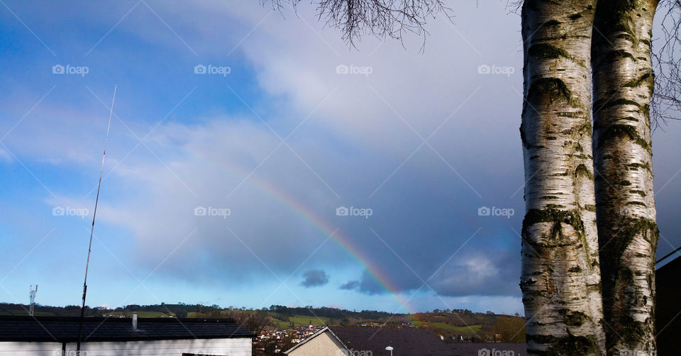Clouds and a rainbow over Newtown Powys Wales