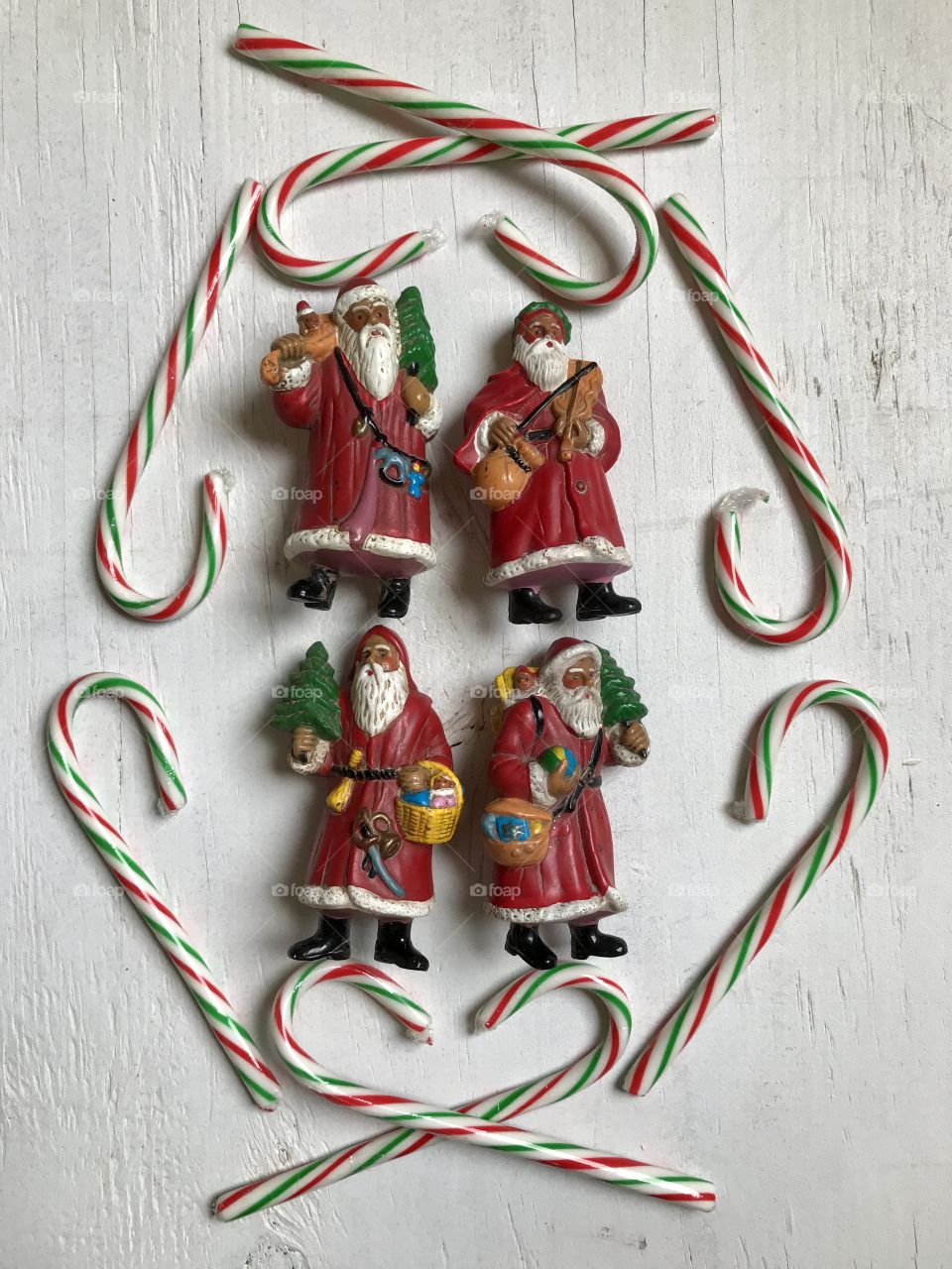 Santa Claus and  candy canes on a white background