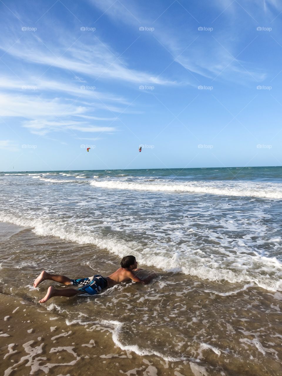 Laying in surf