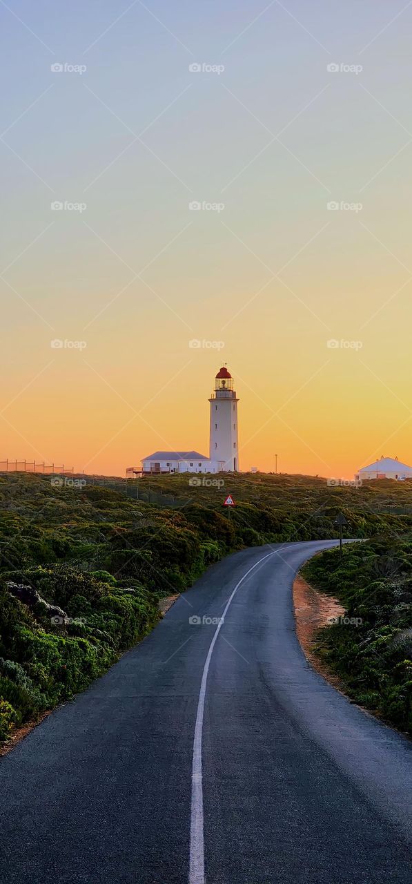 Danger Point Lighthouse in the background of amazing sunset near Gansbaai, South Africa