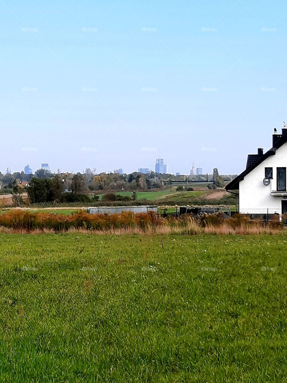 distant skyline of city seen from countyside