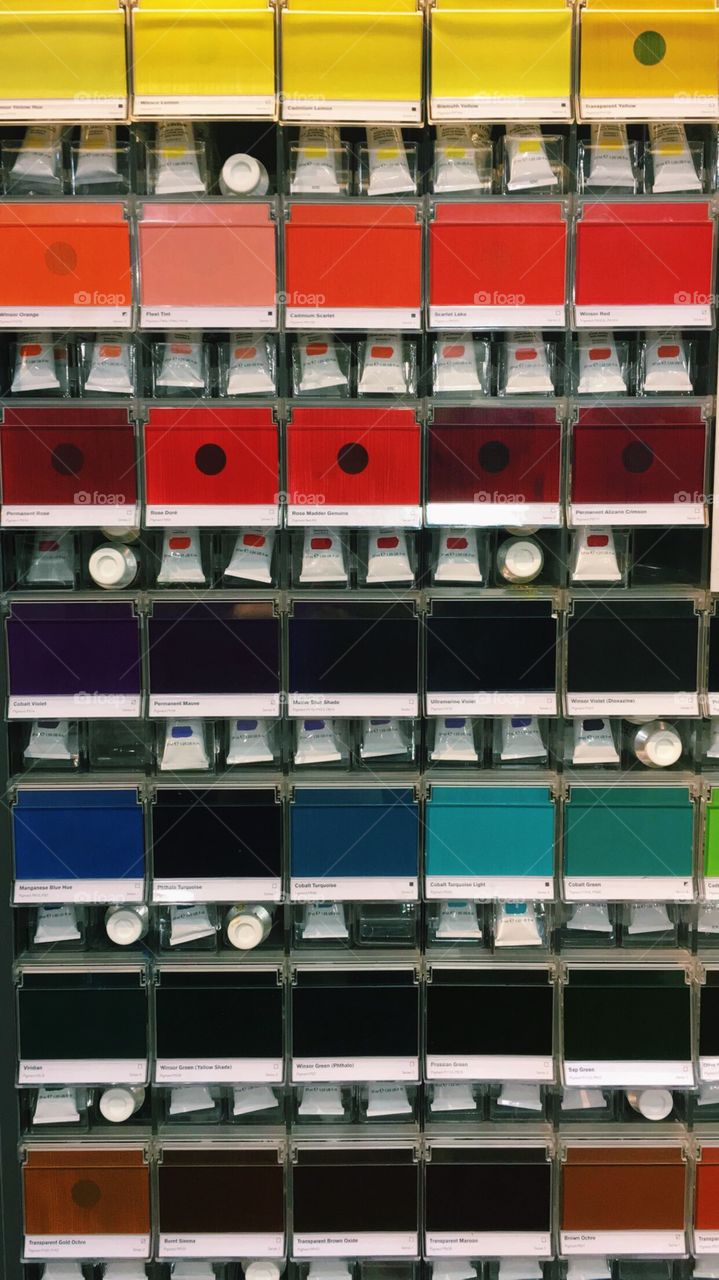This is a picture taken inside of an art supply store. The colors show organization and are aesthetically pleasing.