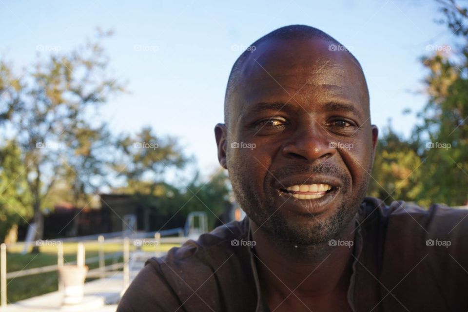 Smiling African man at the Zambezi River in Zimbabwe 