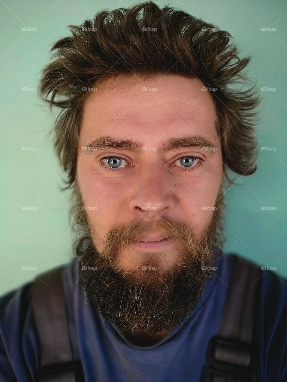 Portrait of bearded man looking to camera