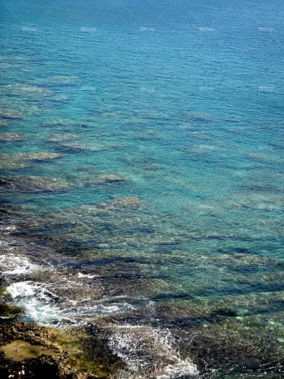 Coast with clear ocean and stones