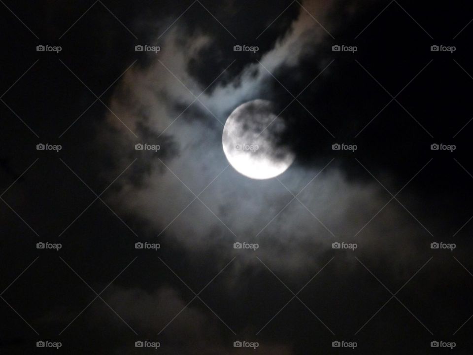 clouds in front of the full moon