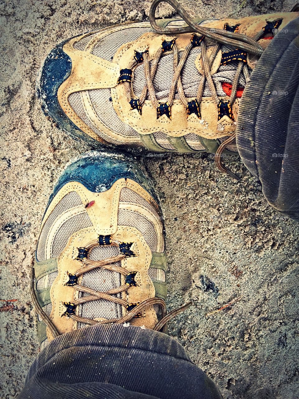 Pondering which direction to take. One foot pointing left, one foot pointing forward. Walking boots on and ready to take that step and begin the journey.