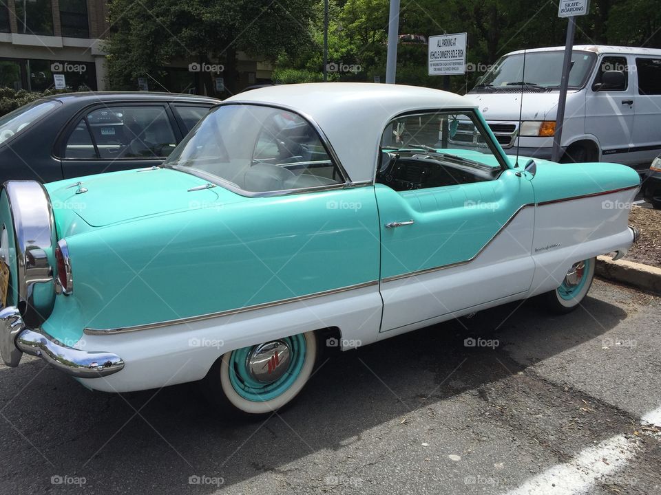 Mint green and white vintage car from the 1950s