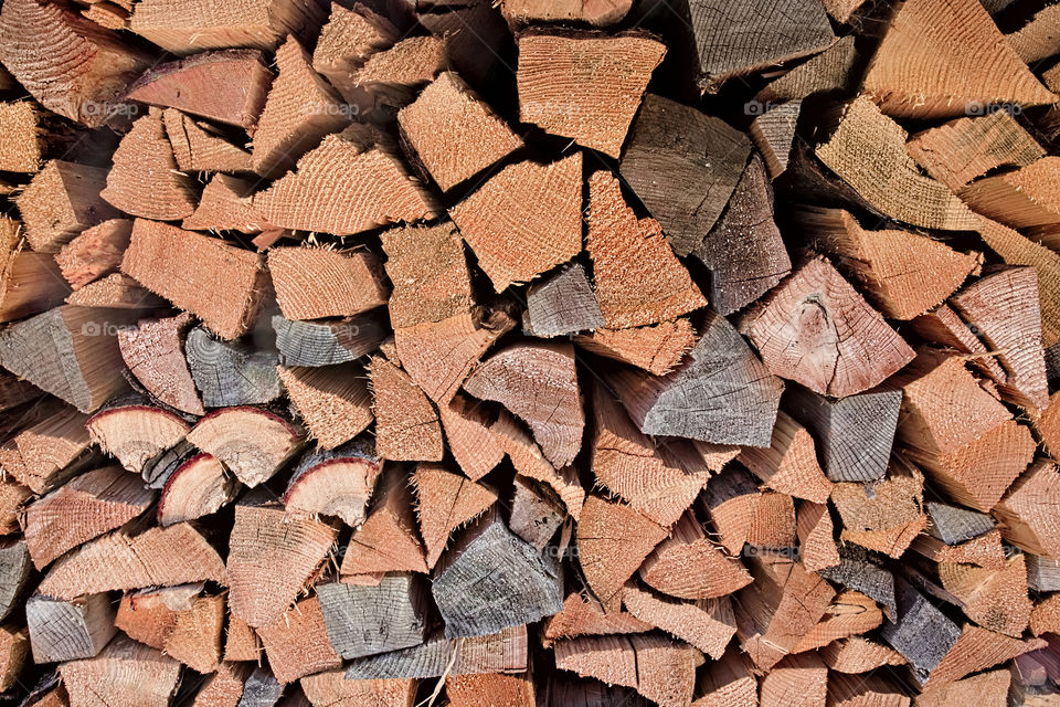 Triangular shaped wood logs stackef