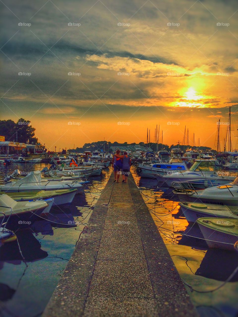 Sunset by sea port. Sunset by sea port of Croatian coast; Porec town.