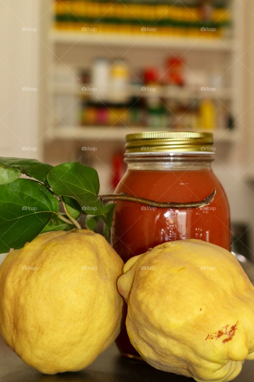 Closeup view fresh preserves foreground blurred kitchen background organic farm fresh quince fruit 