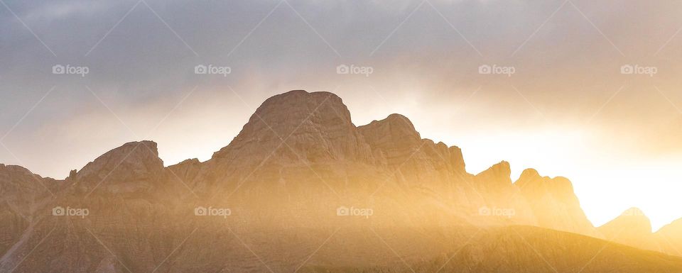 sun in the mountains