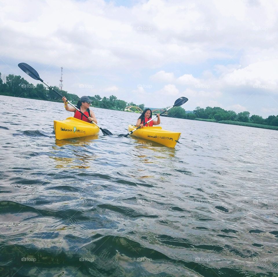 Friends kayaking 