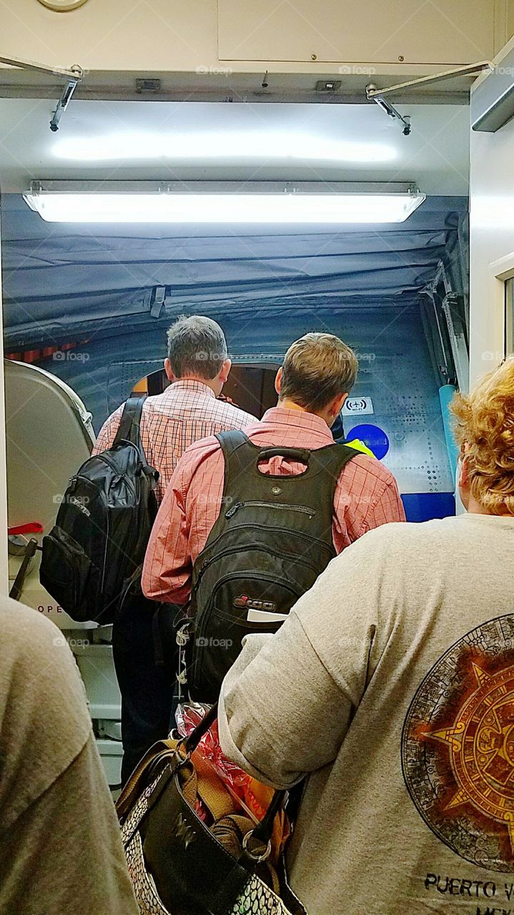 people boarding a plane