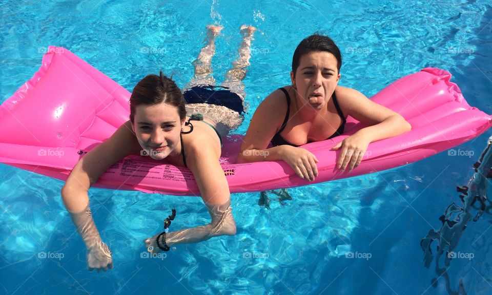 Two woman in inflatable mattress