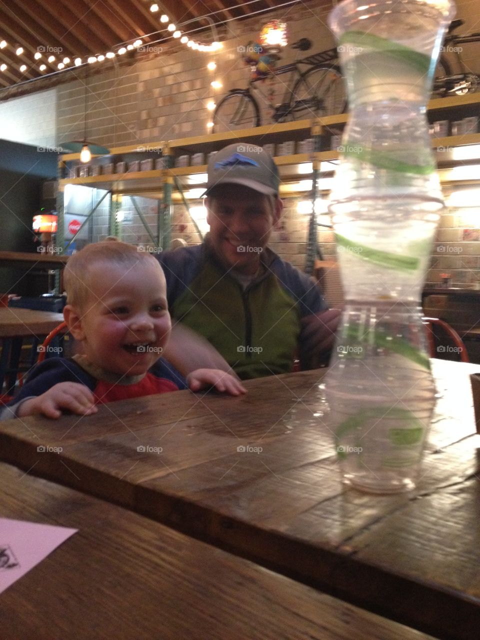 Father and son stacking cups 