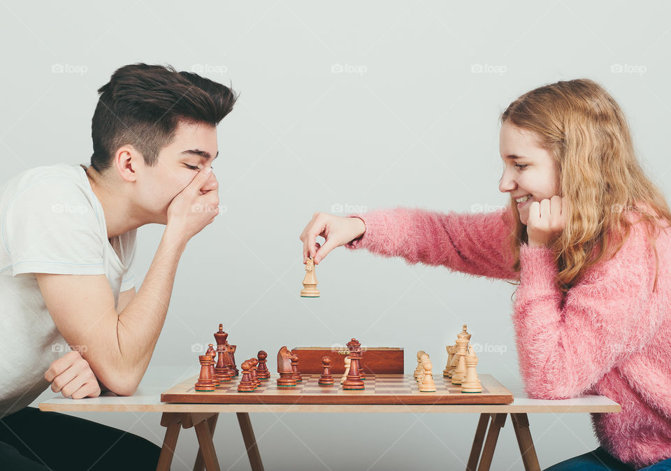Checkmate. Boy is surprised by last move his opponent in chess game. Copy space for text at the top of image