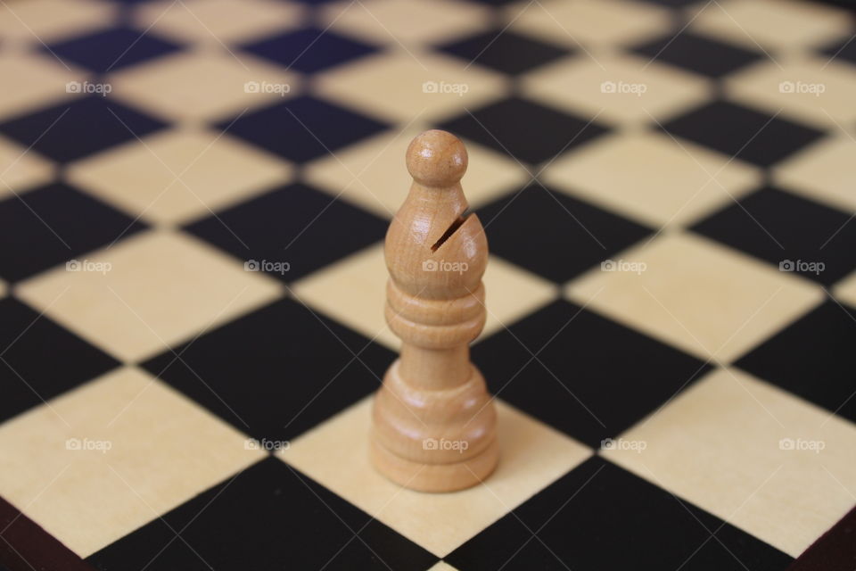 chess board and one wooden piece