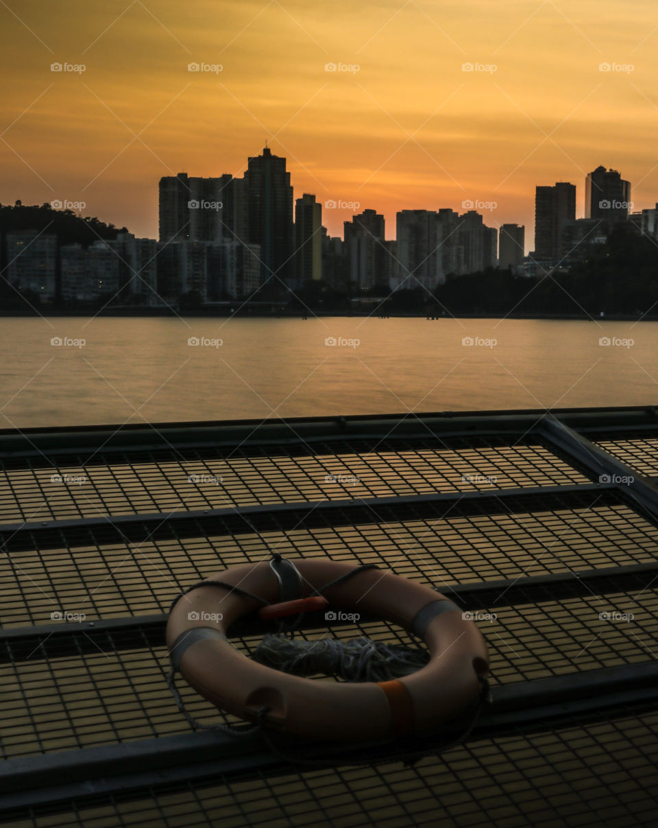 Other Perspective view of the Residential buildings from a nearby water reservoir after the sunset.