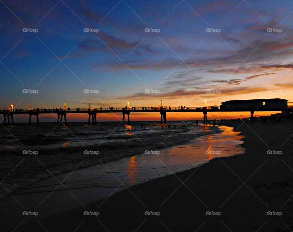 Sunrise, sunset and the moon - Crimson, amber and tangerine beams were thrown into the dusty sky. A silky tangerine reflection glistened off the incoming waves as the sun dipped below the horizon