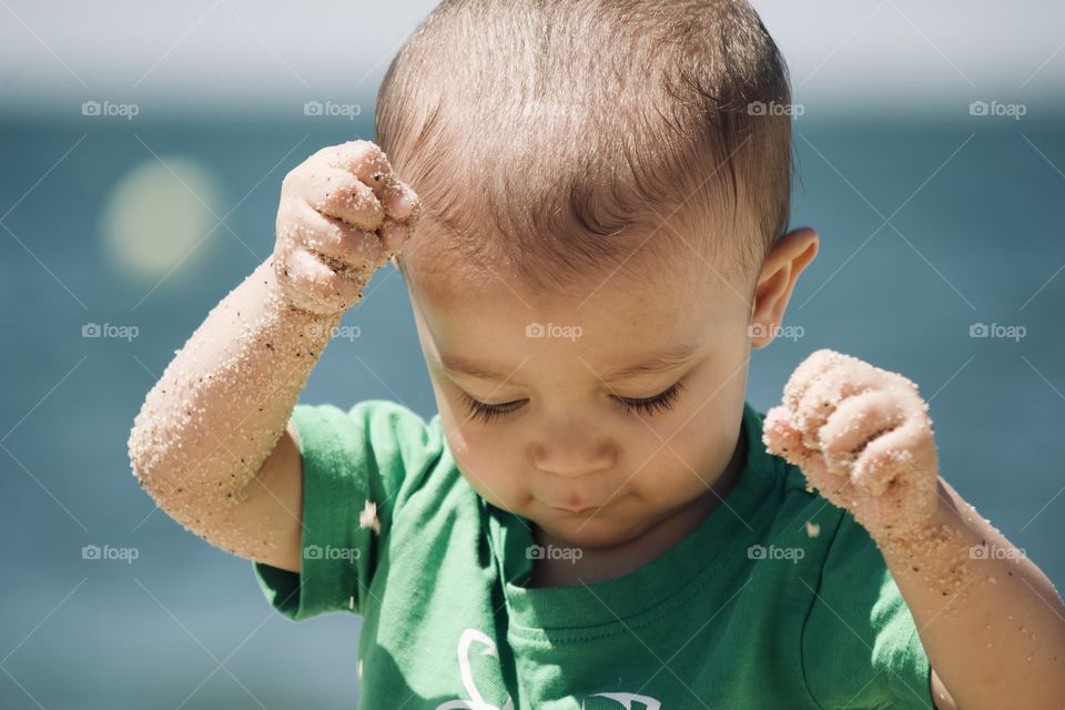 Baby playing in the sand