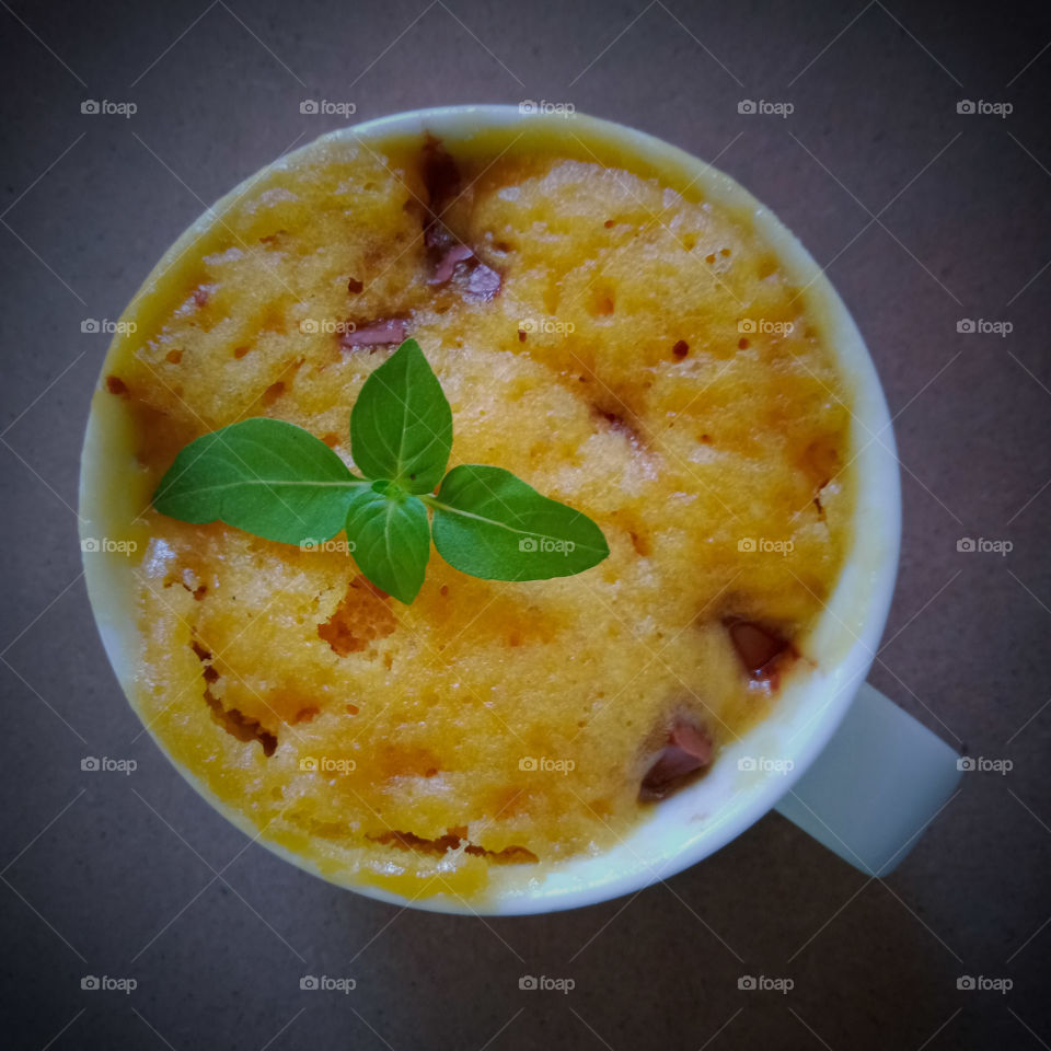 microwave cake in a white ceramic mug .