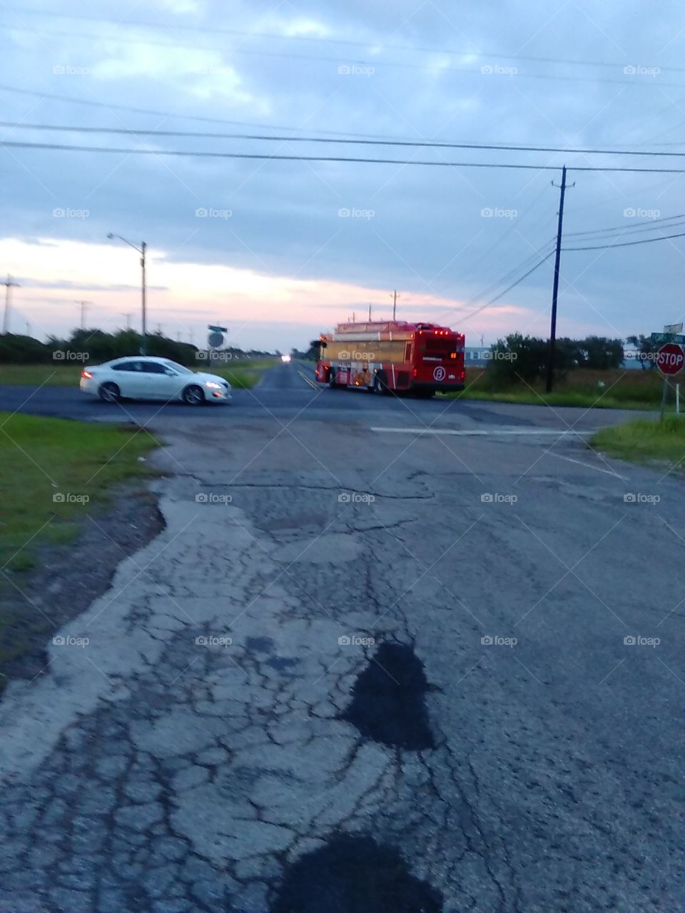 Bus And Car At Crossing