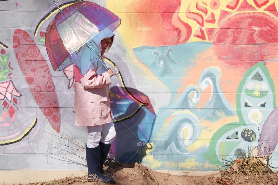 Colorful mural with woman holding umbrella 
