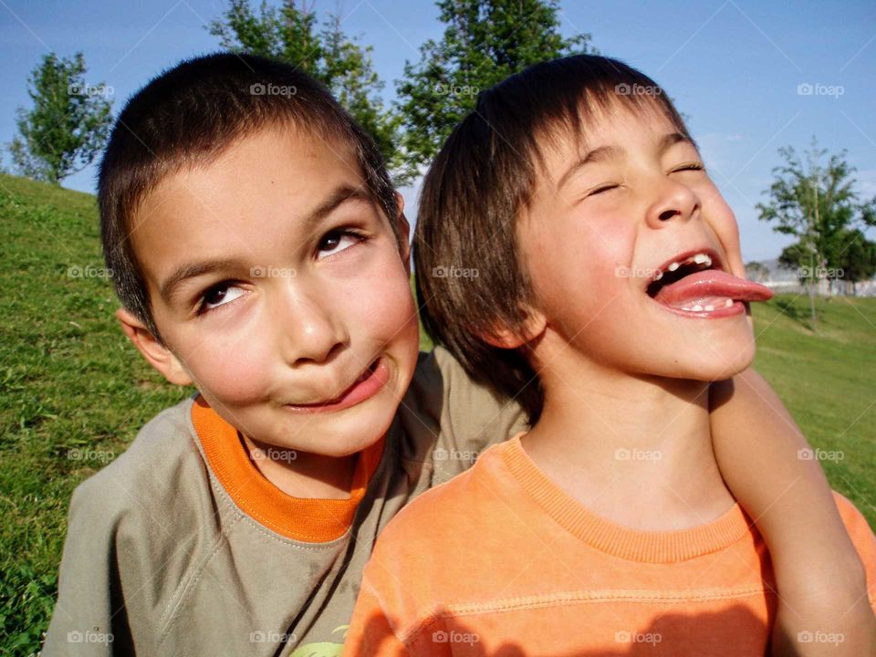 Two silly young boys making faces for the camera