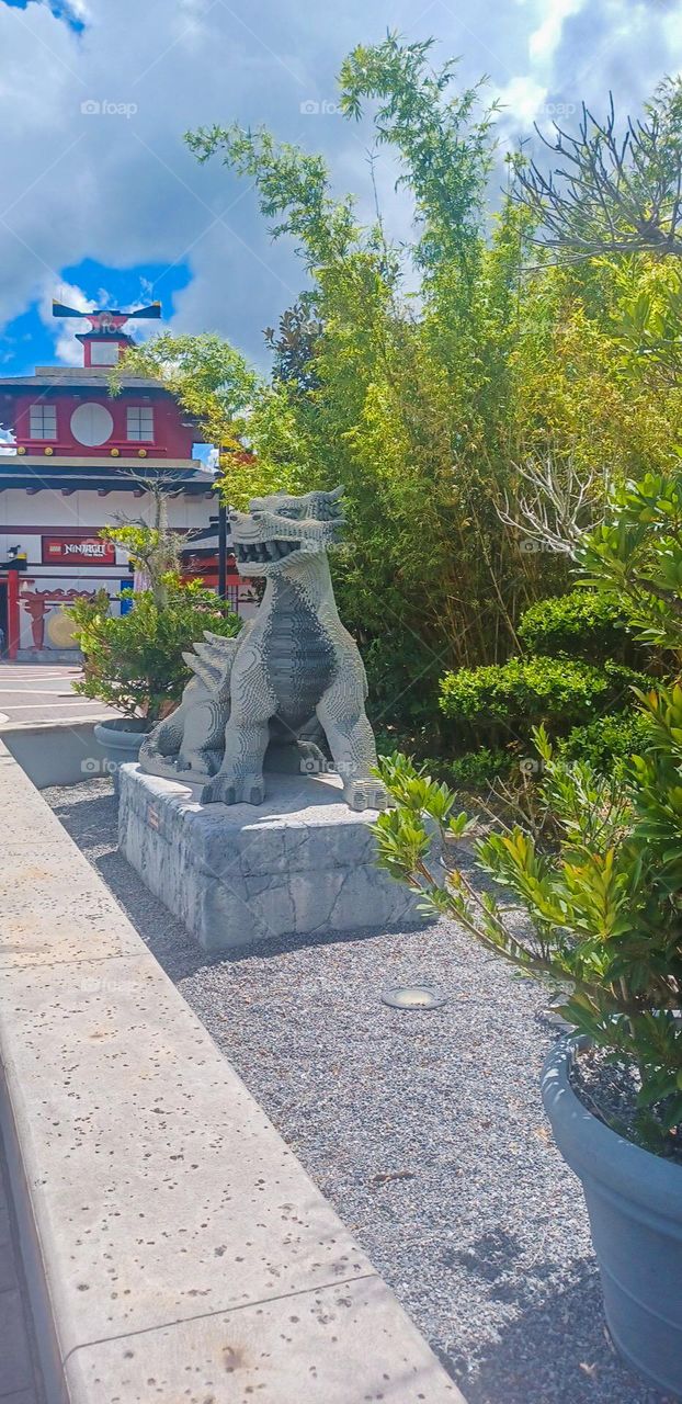 Dragon statue made of legos in an amusement park 