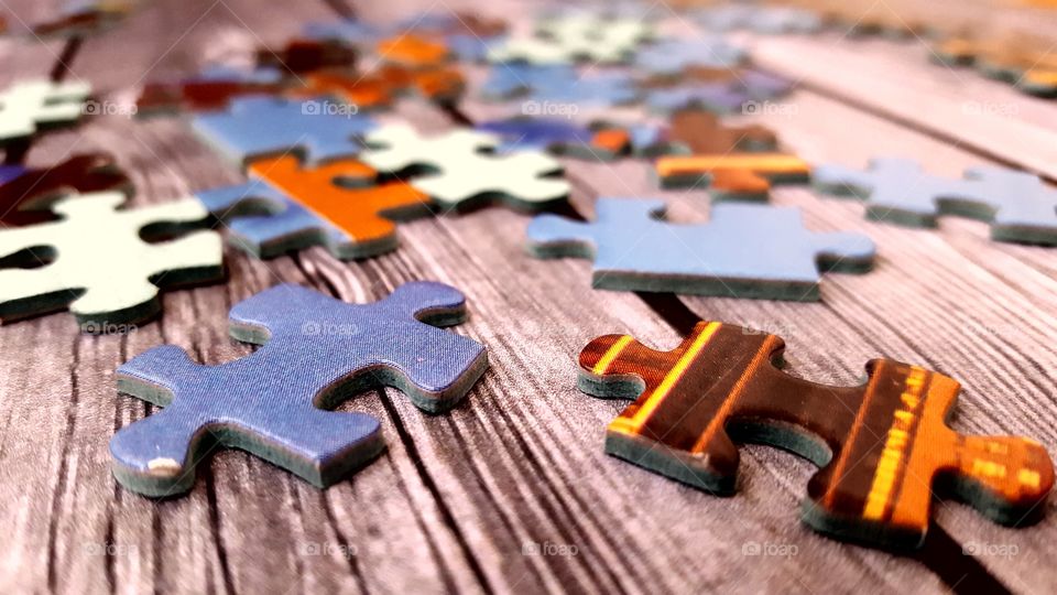 Puzzle pieces on a wooden table