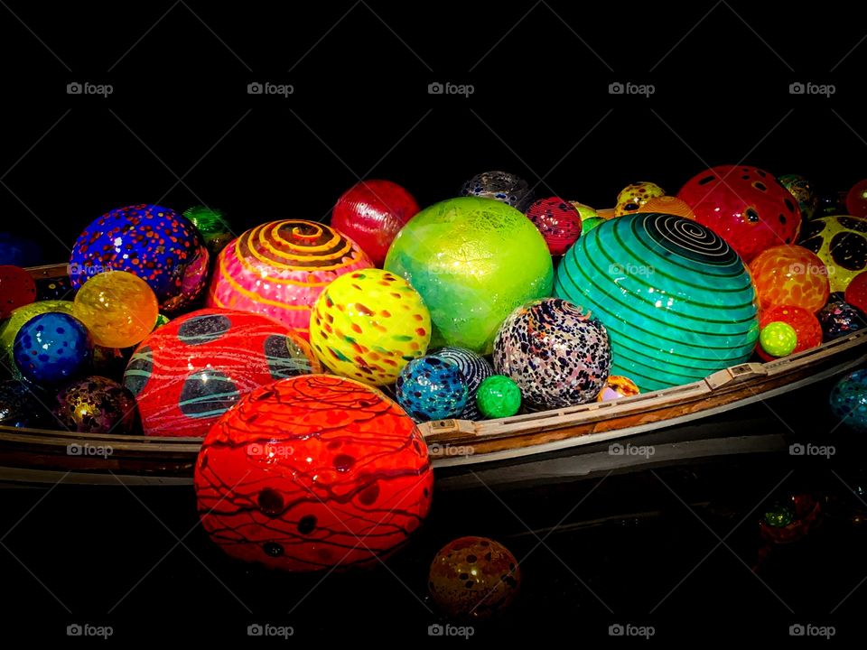 Chihuly colorful glass balls in a boat at the Chihuly glass museum in Seattle, Washington. 