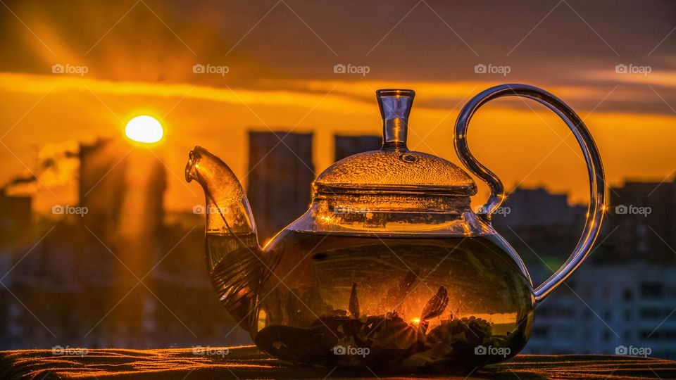 the reflection of the sun in the teapot