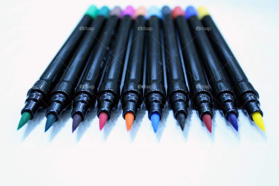 colored pens in a row