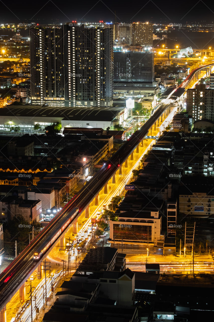 BTS train over traffic jam on the road in Bangkok