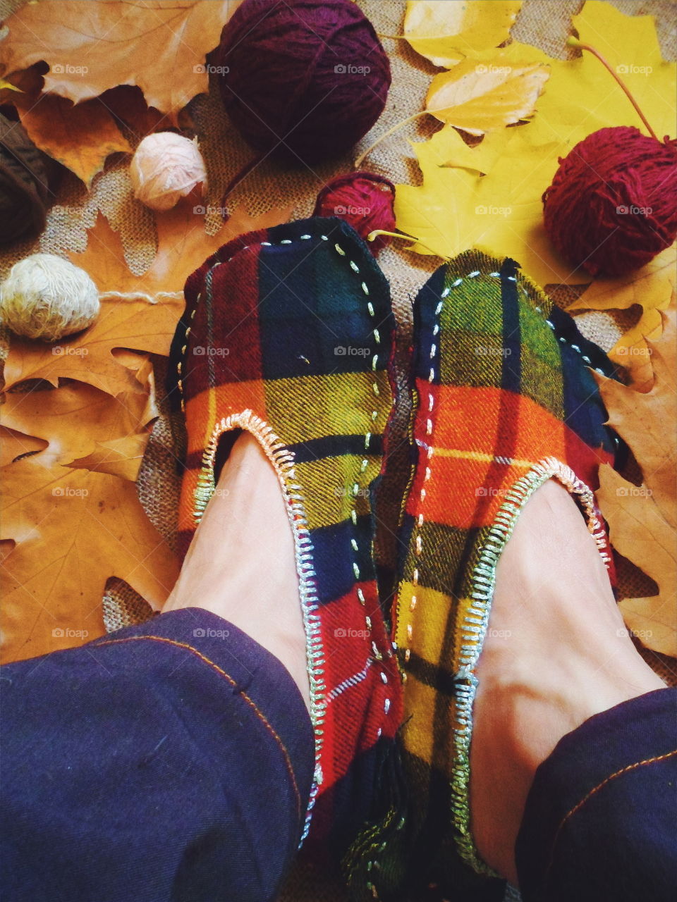 stitched warm slippers and autumn leaves