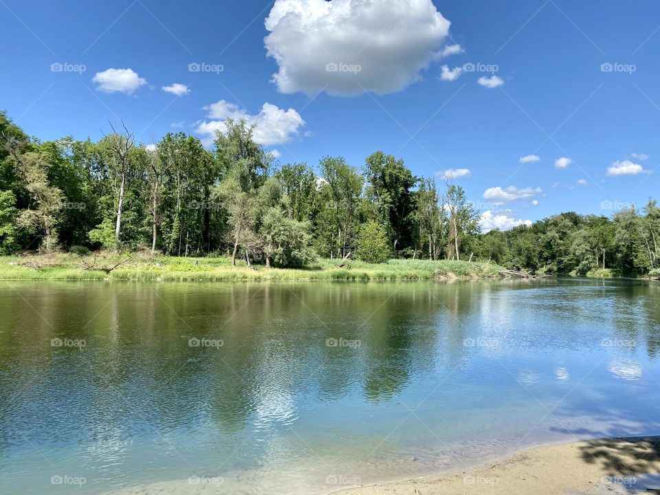 water landscape grass and clouds