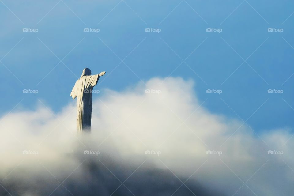 Corcovado . The Statue of Christ the Redeemer in the clouds 