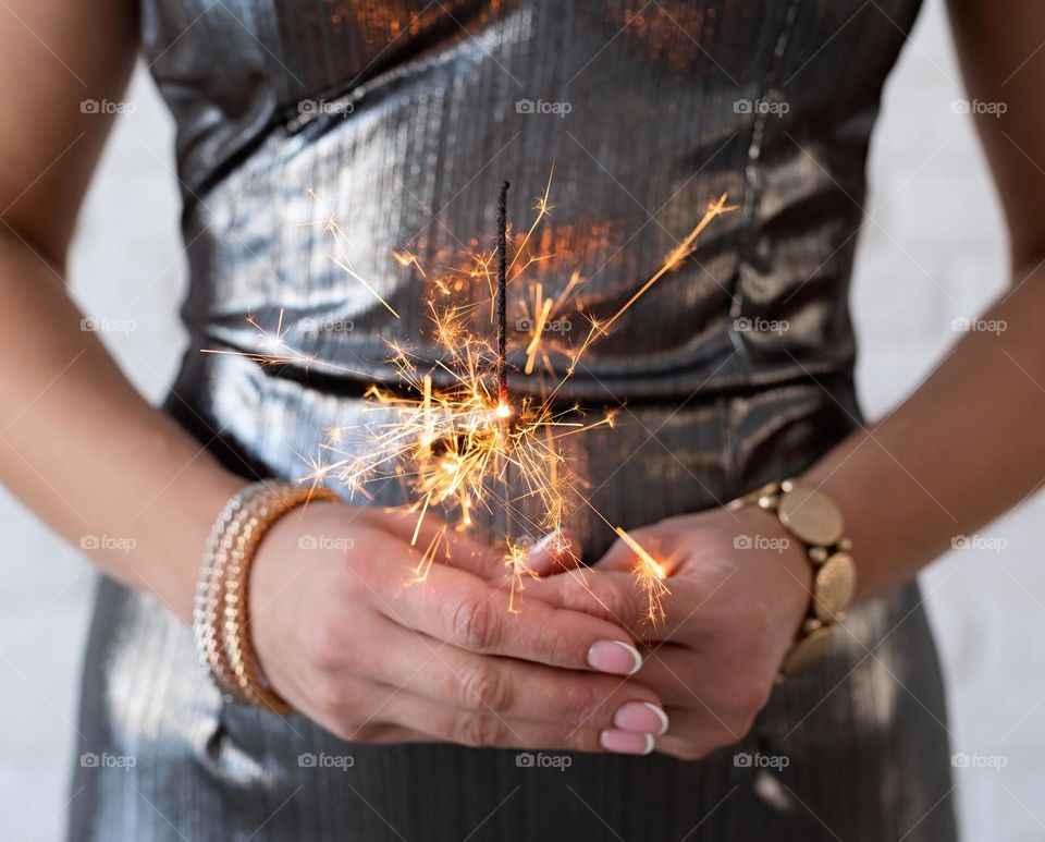 woman hands with sparkler